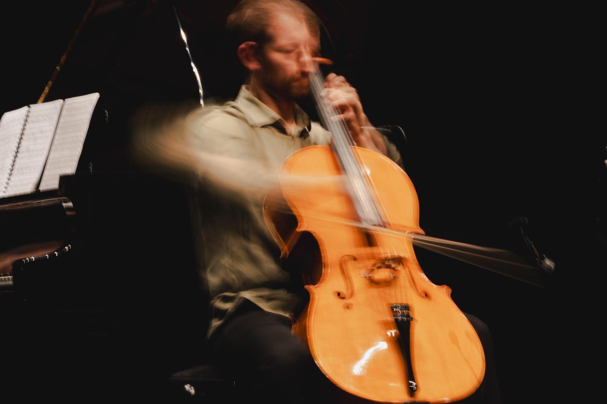 Banner of Joshua Lind playing the Cello